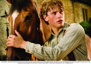 "WAR HORSE" 032b_DM-AC-00040 Albert (Jeremy Irvine) and his horse Joey are featured in this scene from DreamWorks Pictures' "War Horse", director Steven Spielberg's epic adventure set against a sweeping canvas of rural England and Europe during the First World War. Ph: Andrew Cooper, SMPSP ©DreamWorks II Distribution Co., LLC.  All Rights Reserved. "WAR HORSE" 032b_DM-AC-00040 Albert (Jeremy Irvine) and his horse Joey are featured in this scene from DreamWorks Pictures' "War Horse", director Steven Spielberg's epic adventure set against a sweeping canvas of rural England and Europe during the First World War. Ph: Andrew Cooper, SMPSP ©DreamWorks II Distribution Co., LLC.  All Rights Reserved.